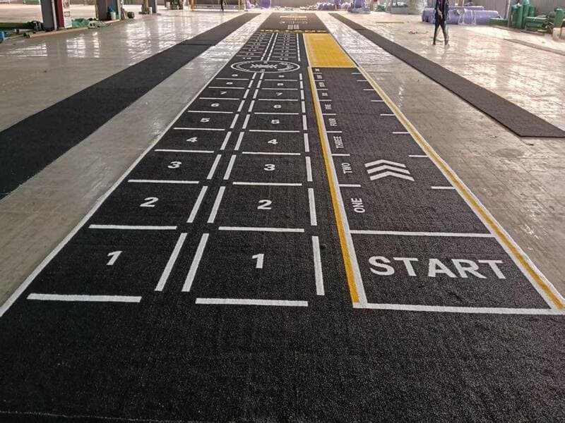 Cross-section technical view showing polyurethane backing penetration into artificial grass tufts for gym flooring stability